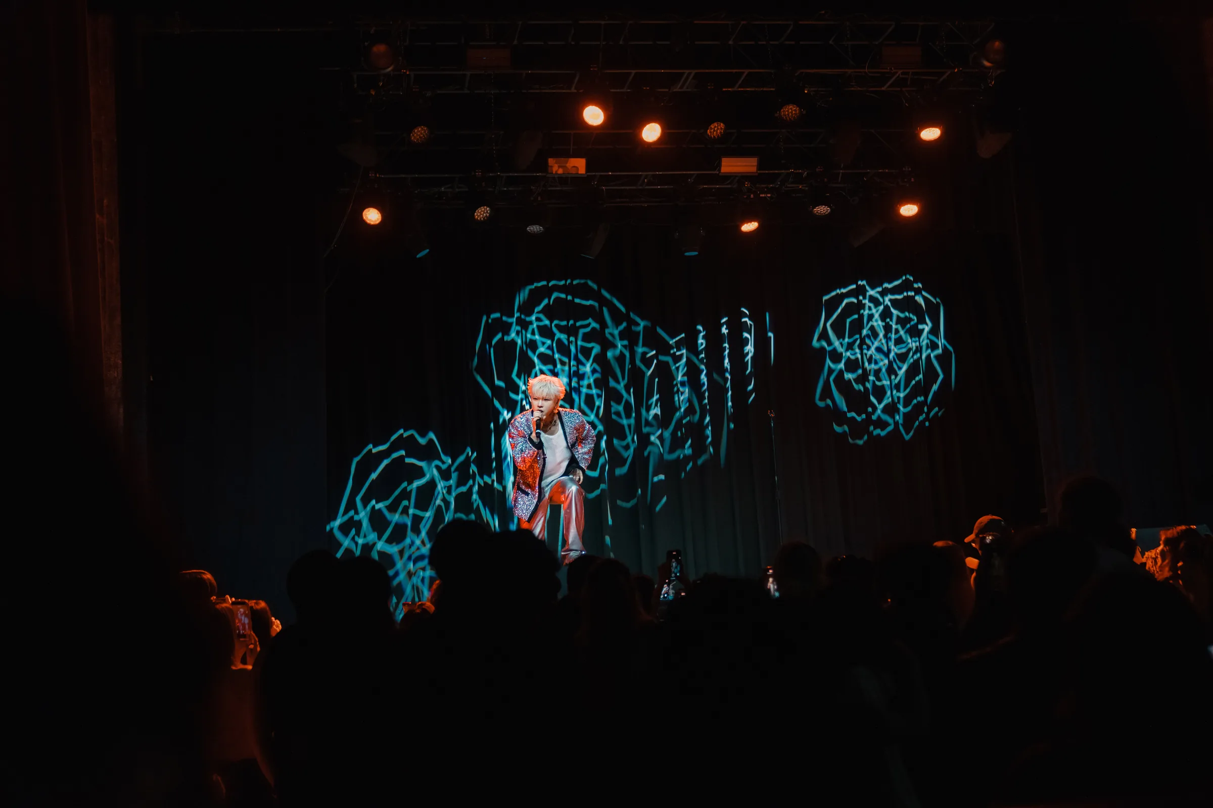 ASH ISLAND performing before a rose stage screen in Atlanta