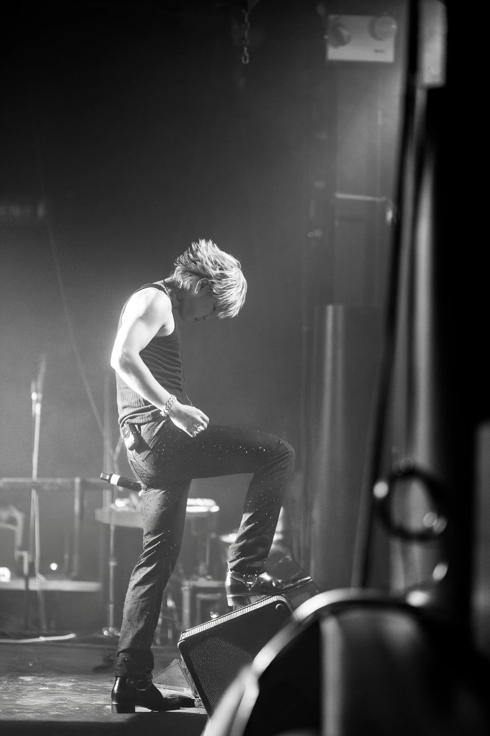 ASH ISLAND performing on stage in a black-and-white full-body photograph