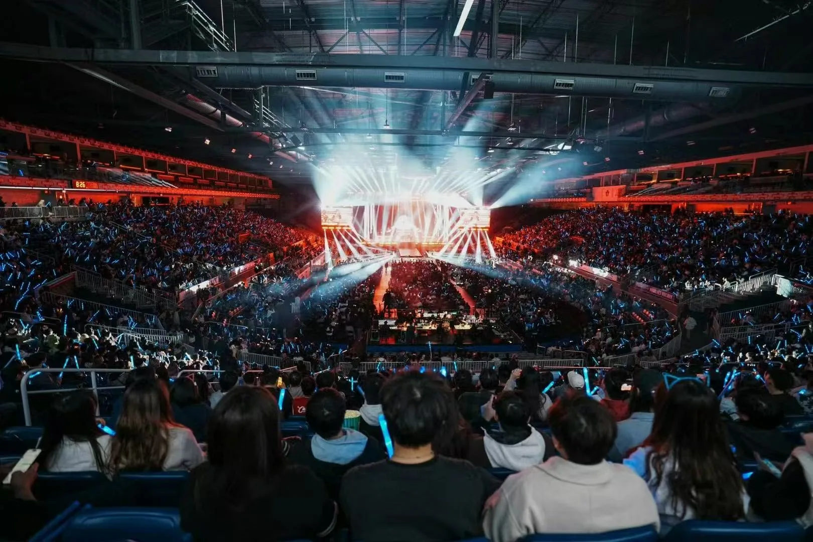 Joker Xue's Canada arena audience under red and blue lighting