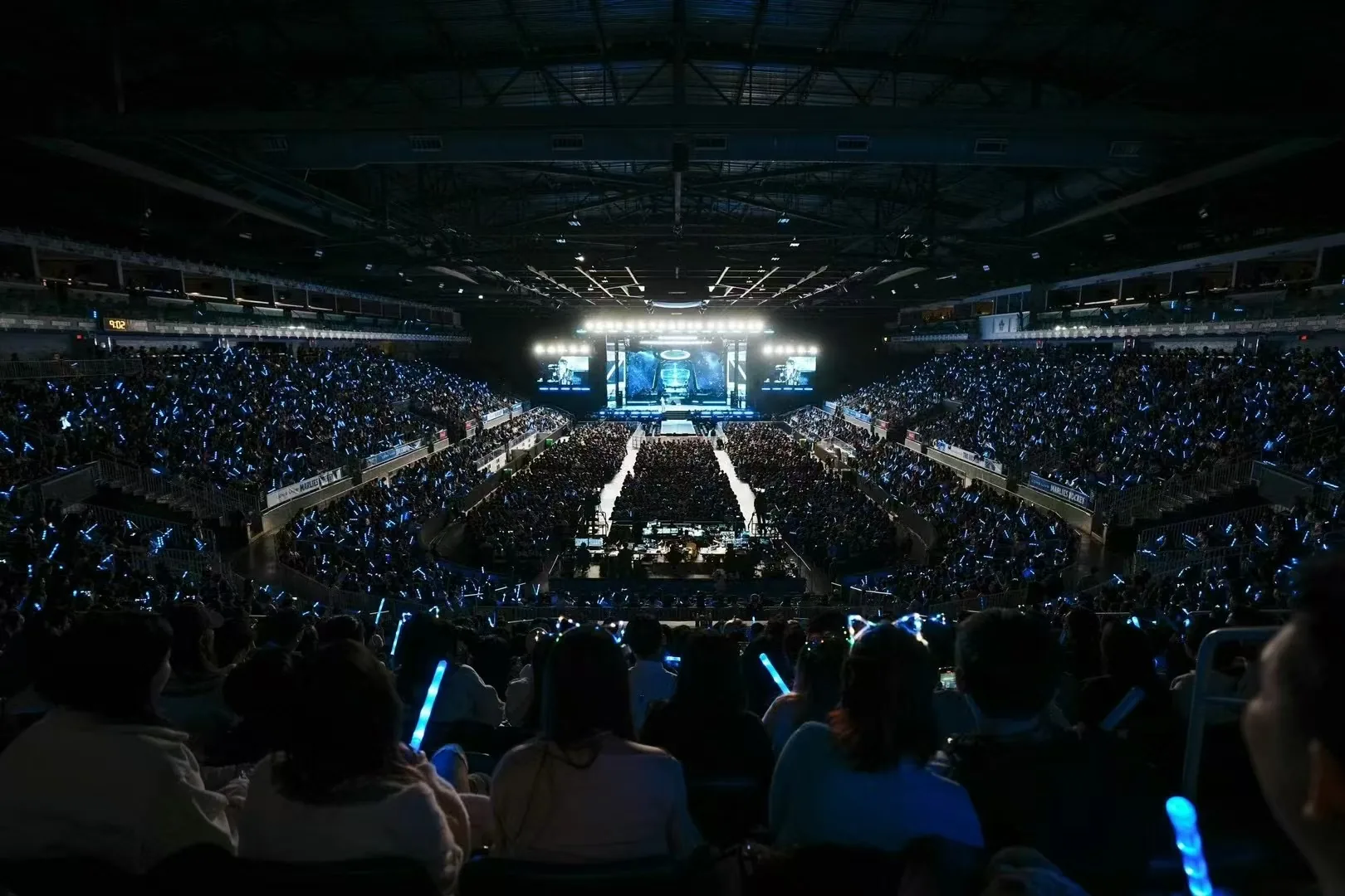 Joker Xue's Canada arena runway and audience under blue light